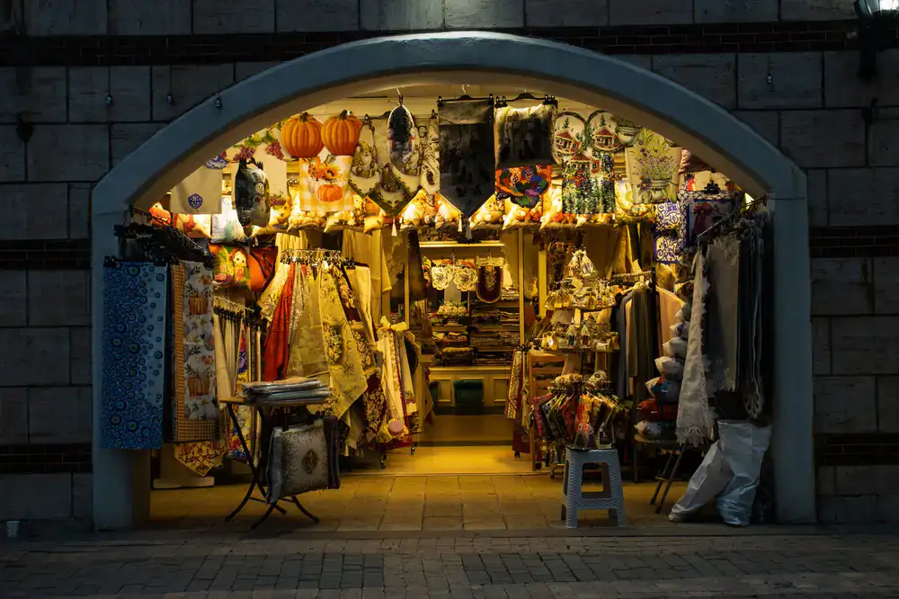 A view of our shop window displaying colourful fabrics
